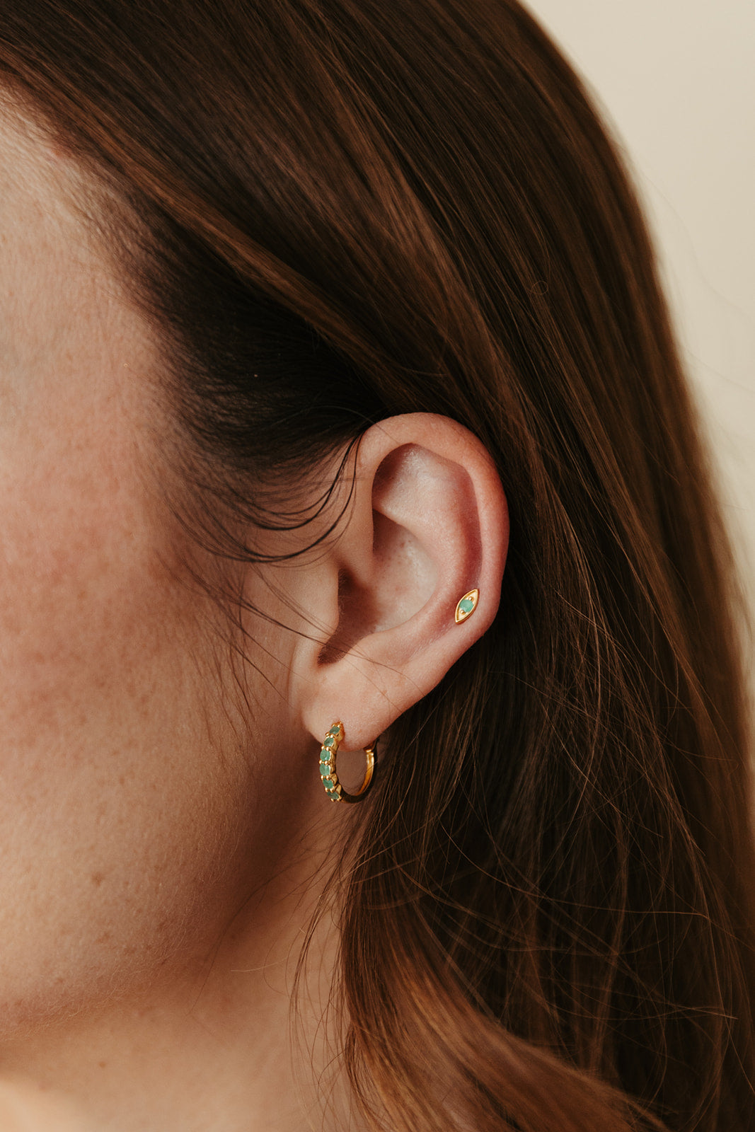 gold vermeil and emerald evil eye birthstone stud earrings