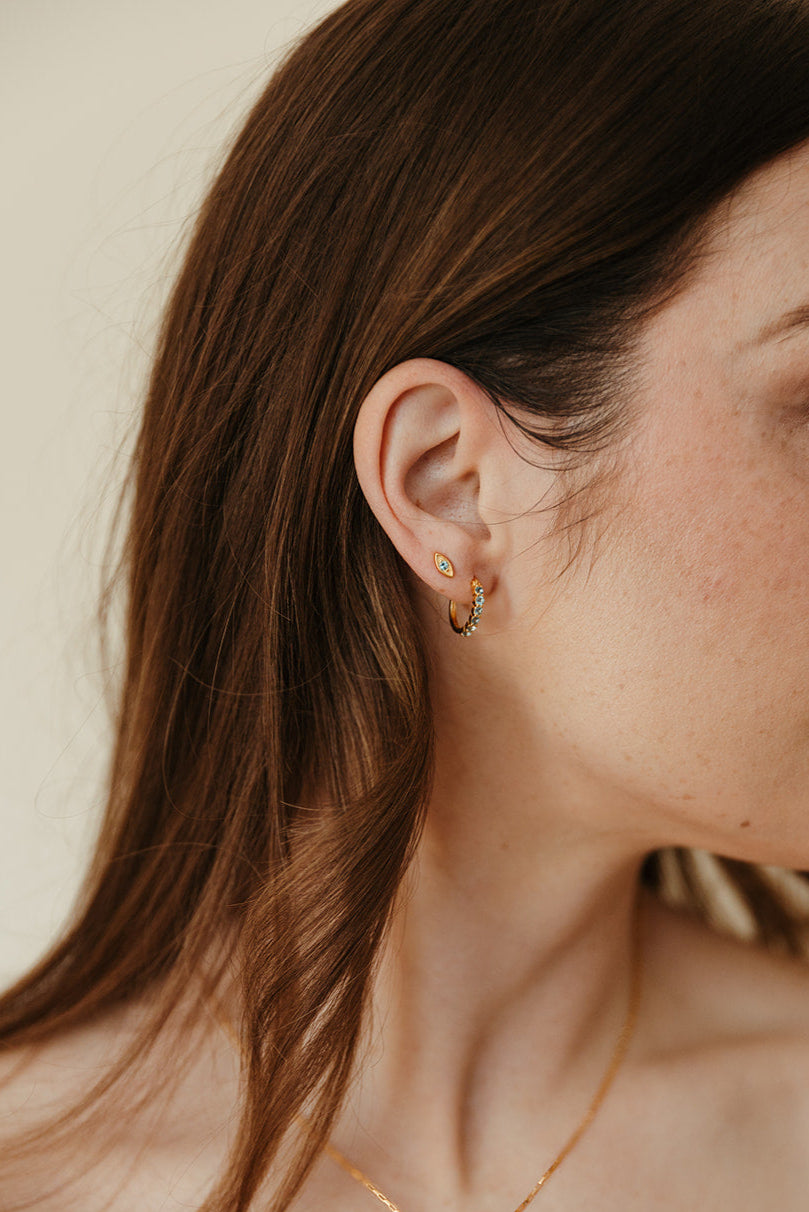 gold vermeil and swiss blue topaz evil eye birthstone stud earrings