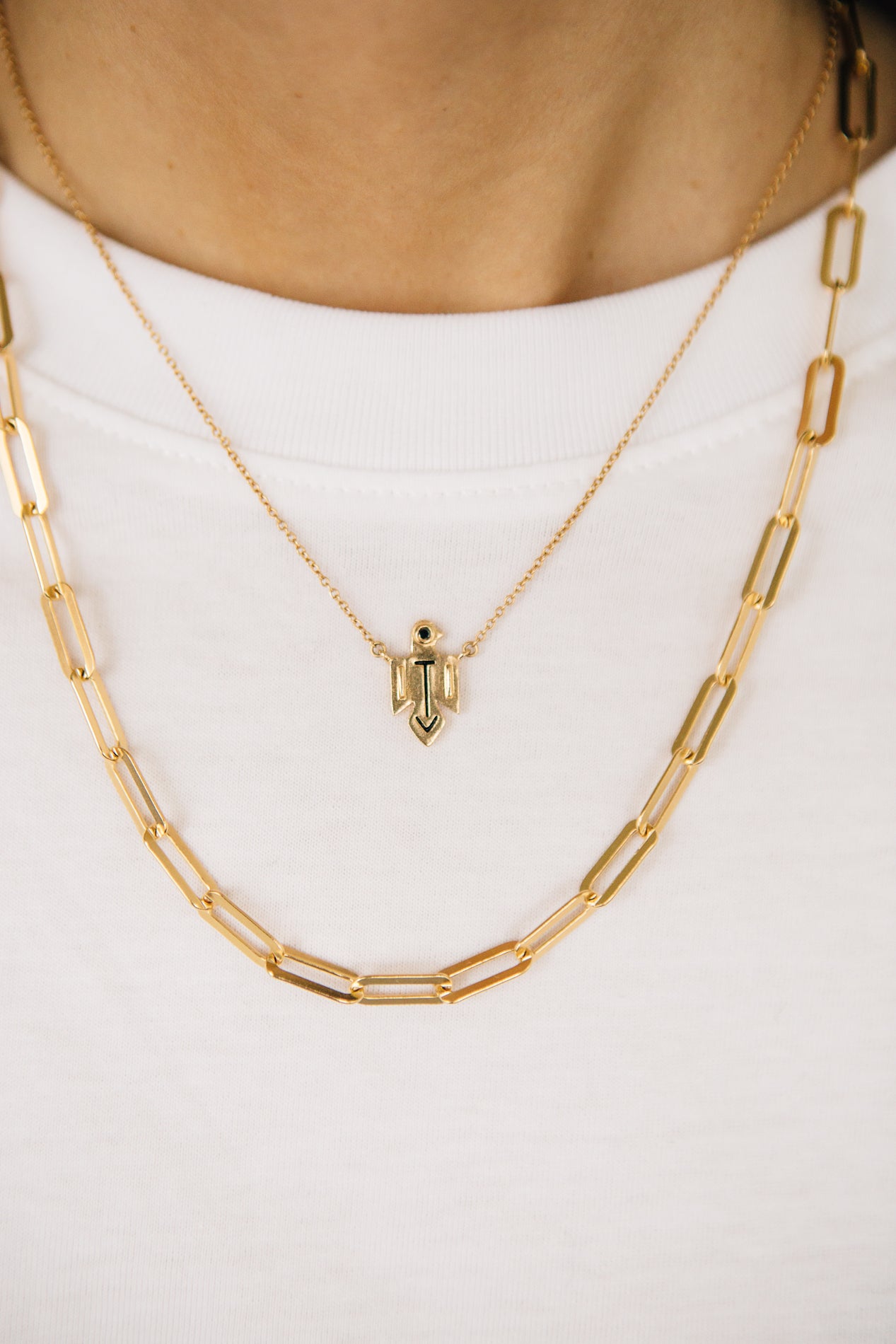 sierra winter gold and black spinel thunderbird necklace