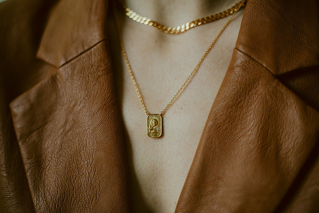 sierra winter jewelry gold vermeil blue topaz sun child pendant token necklace