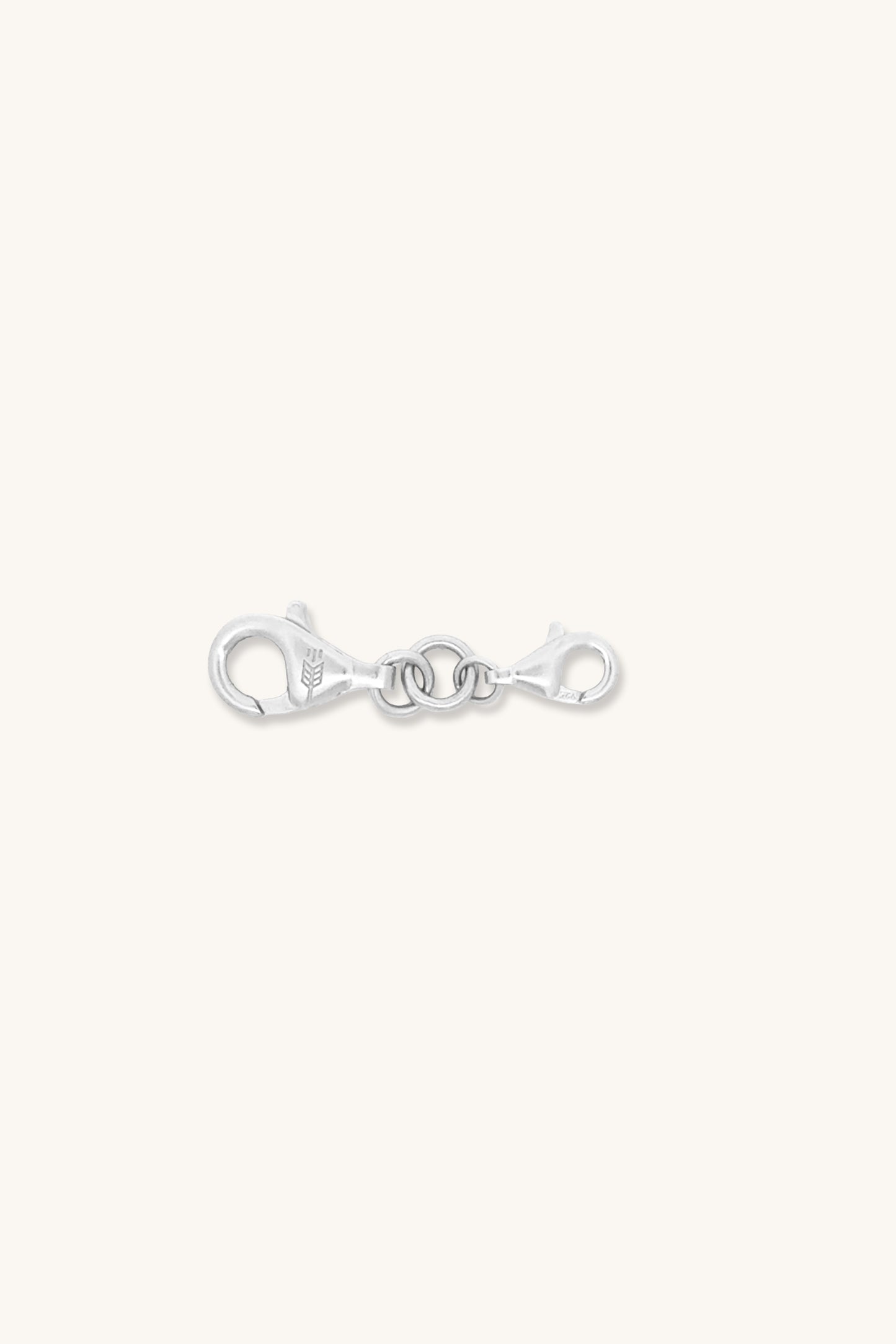 Silver clasp charm on a white background