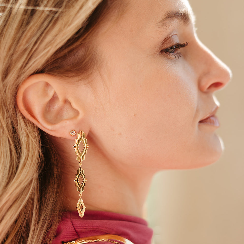 
                      
                        gold vermeil astra drop statement earrings sierra winter
                      
                    