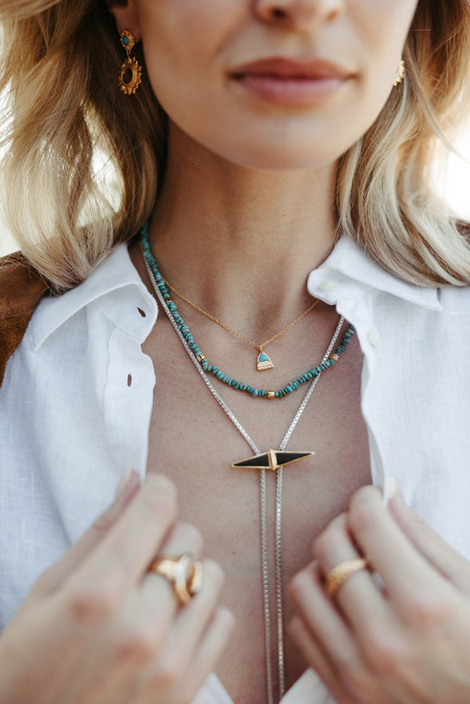 
                      
                        turquoise and gold paloma beaded necklace
                      
                    