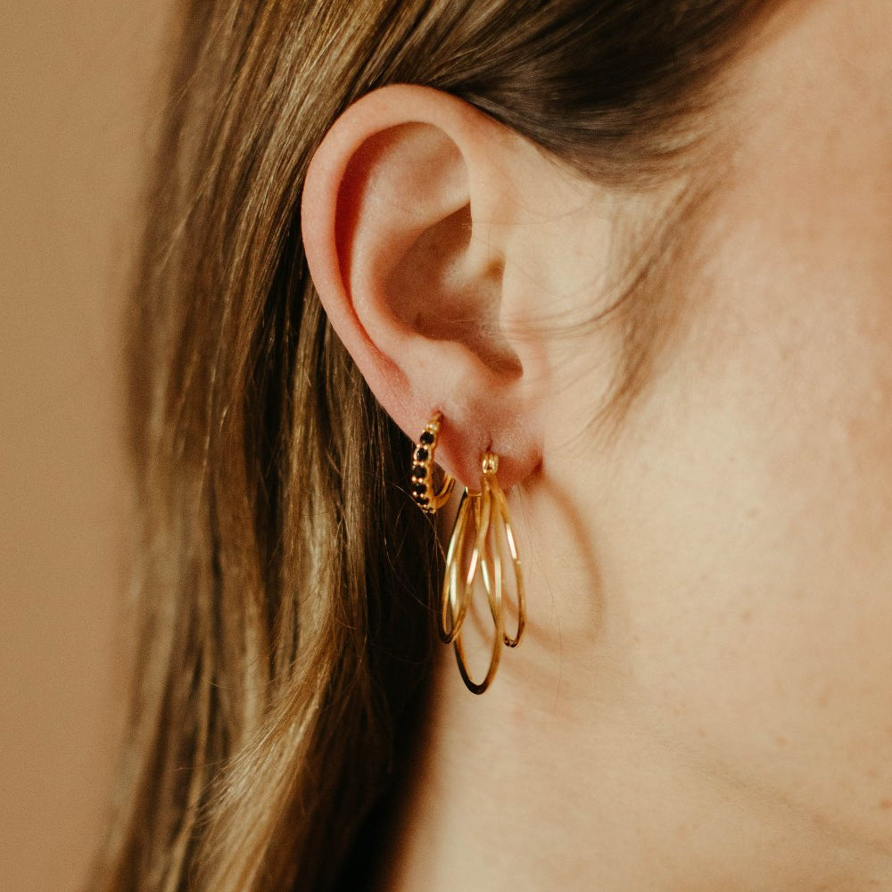 
                      
                        black spinel and gold vermeil karma huggie hoops
                      
                    