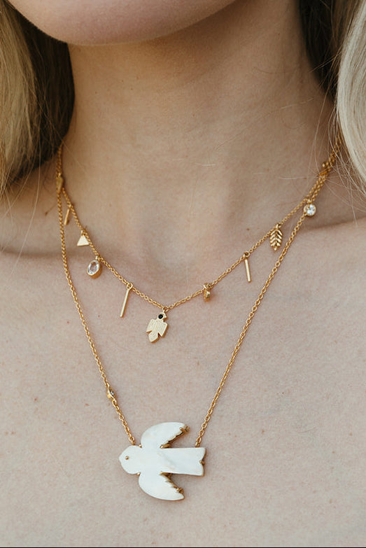 sierra winter free spirit bird necklace mother of pearl talisman charm necklace