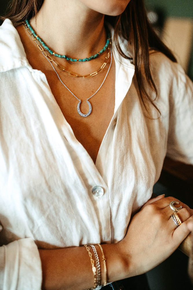 
                      
                        sterling silver and blue sapphire oakley horseshoe pendant necklace
                      
                    