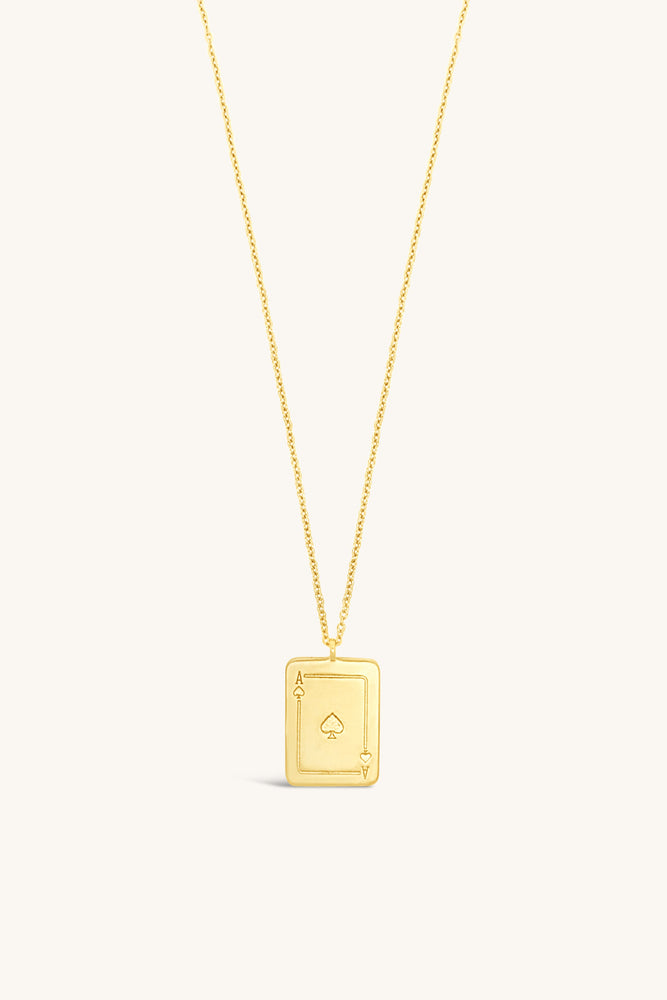 
                      
                        gold and mother of pearl playing card inspired token necklace sierra winter
                      
                    