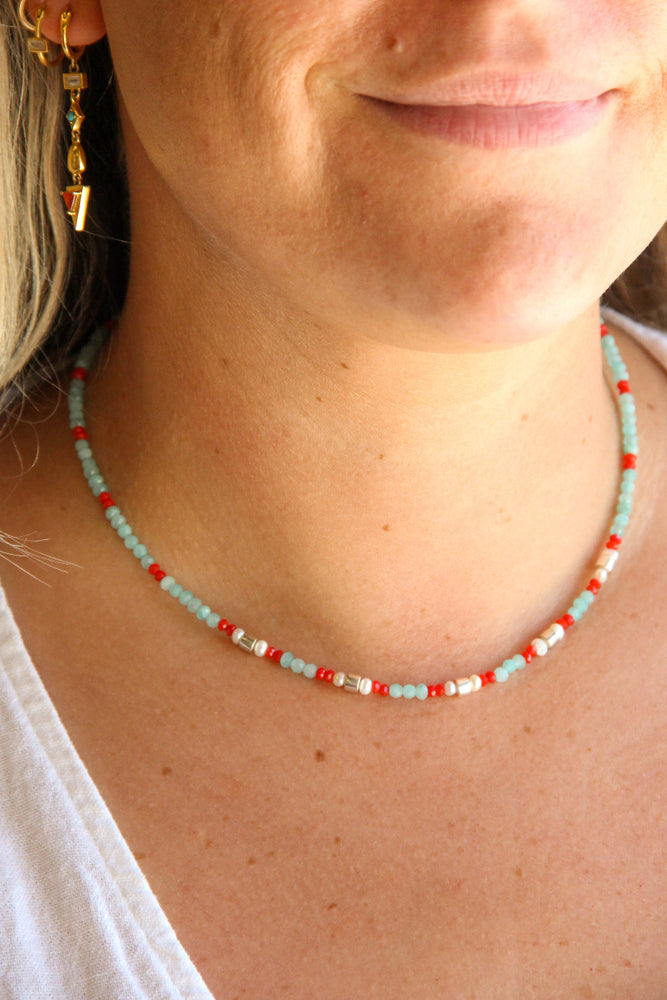 
                      
                        handmade teal and red beaded necklace with silver and pearl accents sierra winter
                      
                    