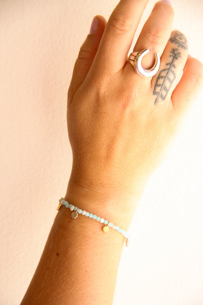 
                      
                        handmade teal beaded bracelet with gold and silver charm accents sierra winter
                      
                    
