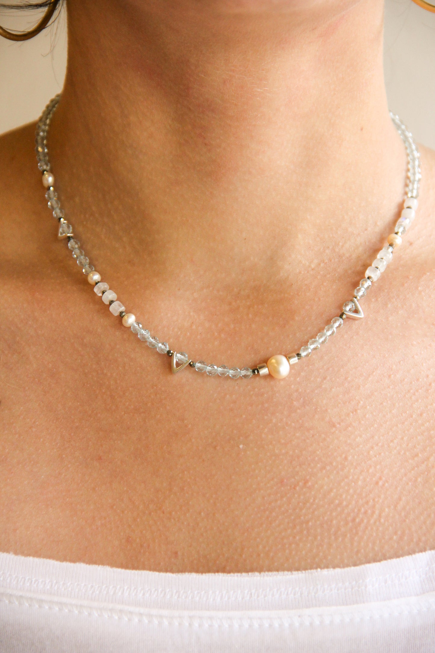 Handmade beaded necklace with blue aquamarine, moonstone, pyrite, and pink pearl