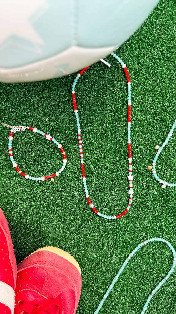 handmade teal and red beaded necklace with silver and pearl accents sierra winter