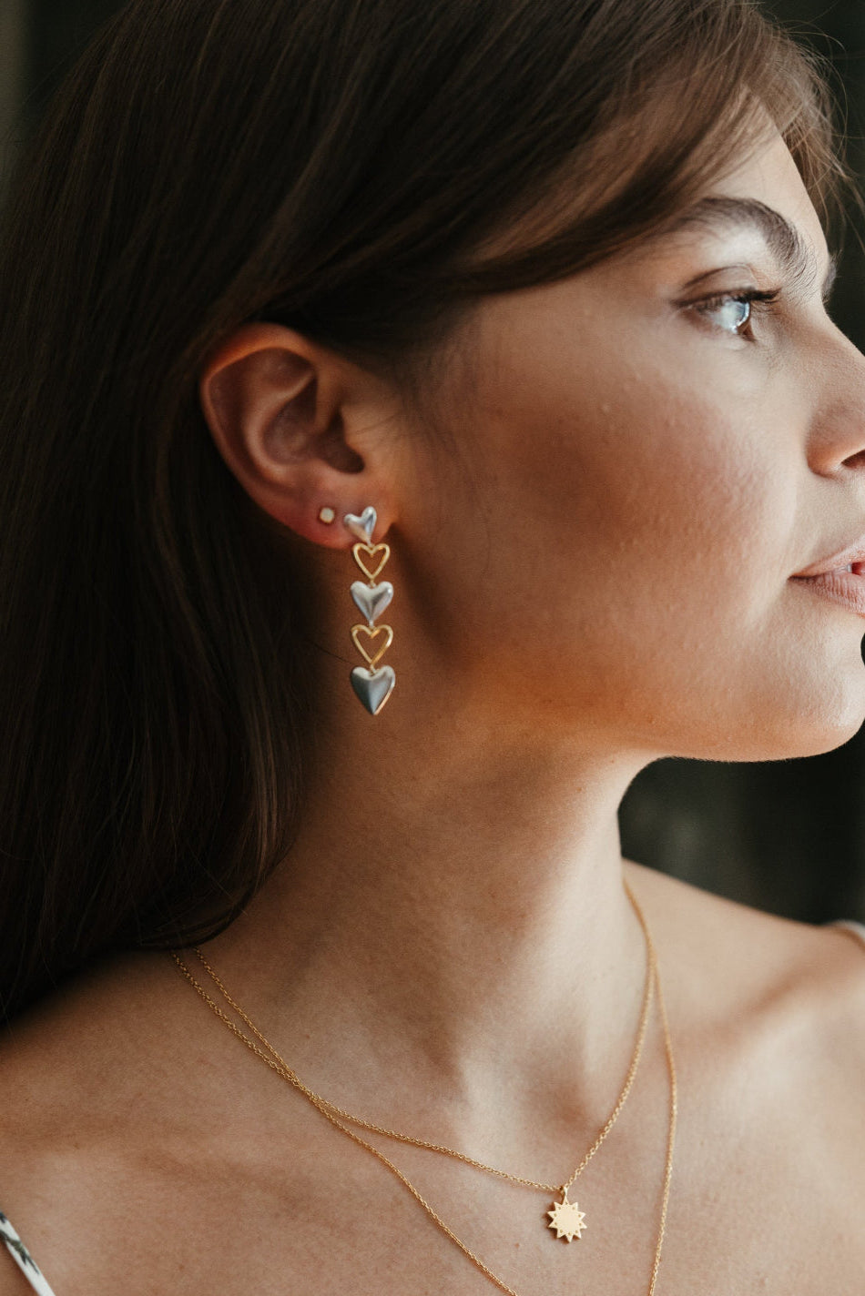mixed metal venus heart drop earrings