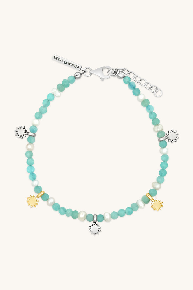 handmade teal beaded bracelet with gold and silver charm accents sierra winter