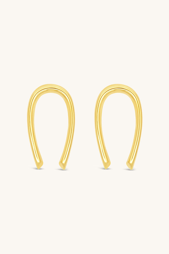 sierra winter sun child statement gold horseshoe earrings