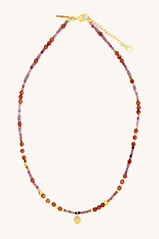Multicolored beaded necklace with a gold flower charm