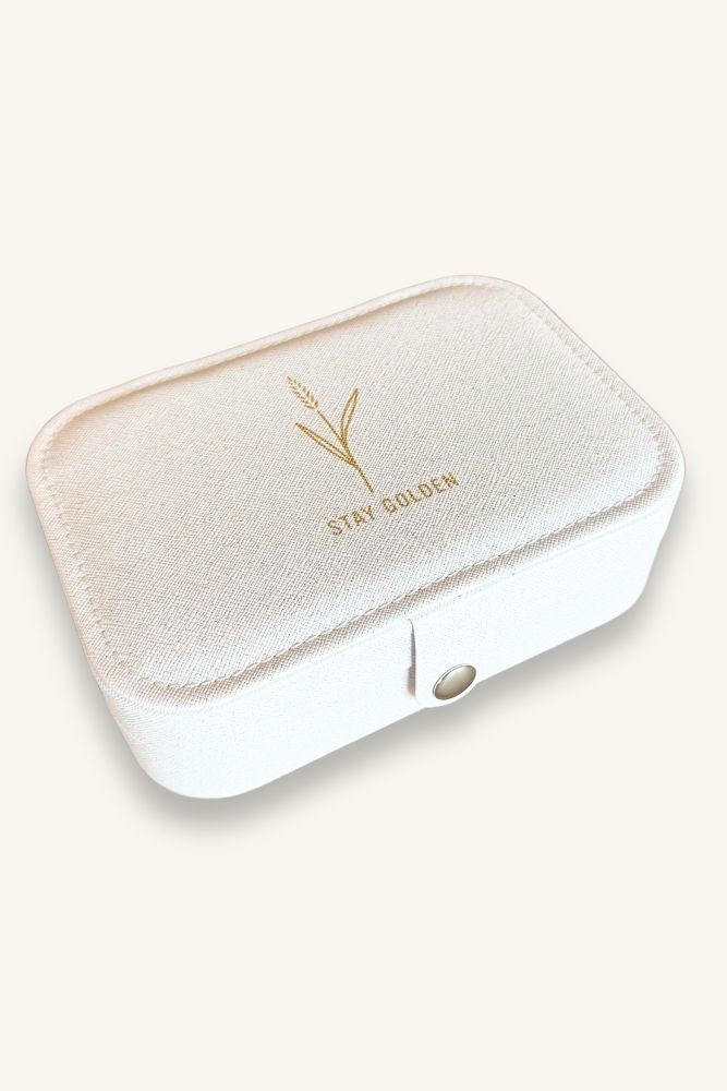White jewelry box with gold text on a white background