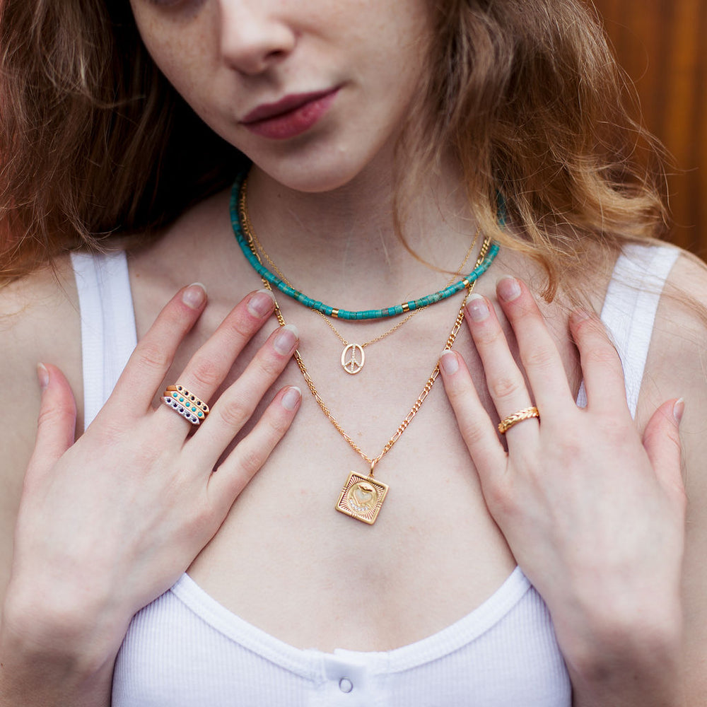 
                      
                        sierra winter gold white topaz peace sign necklace
                      
                    